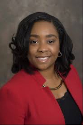 Headshot of smiling woman in a suit