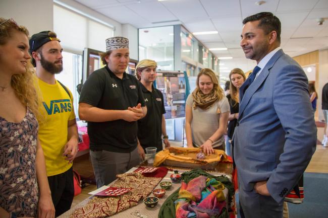 President Nair with a group of students at the Global Expo.